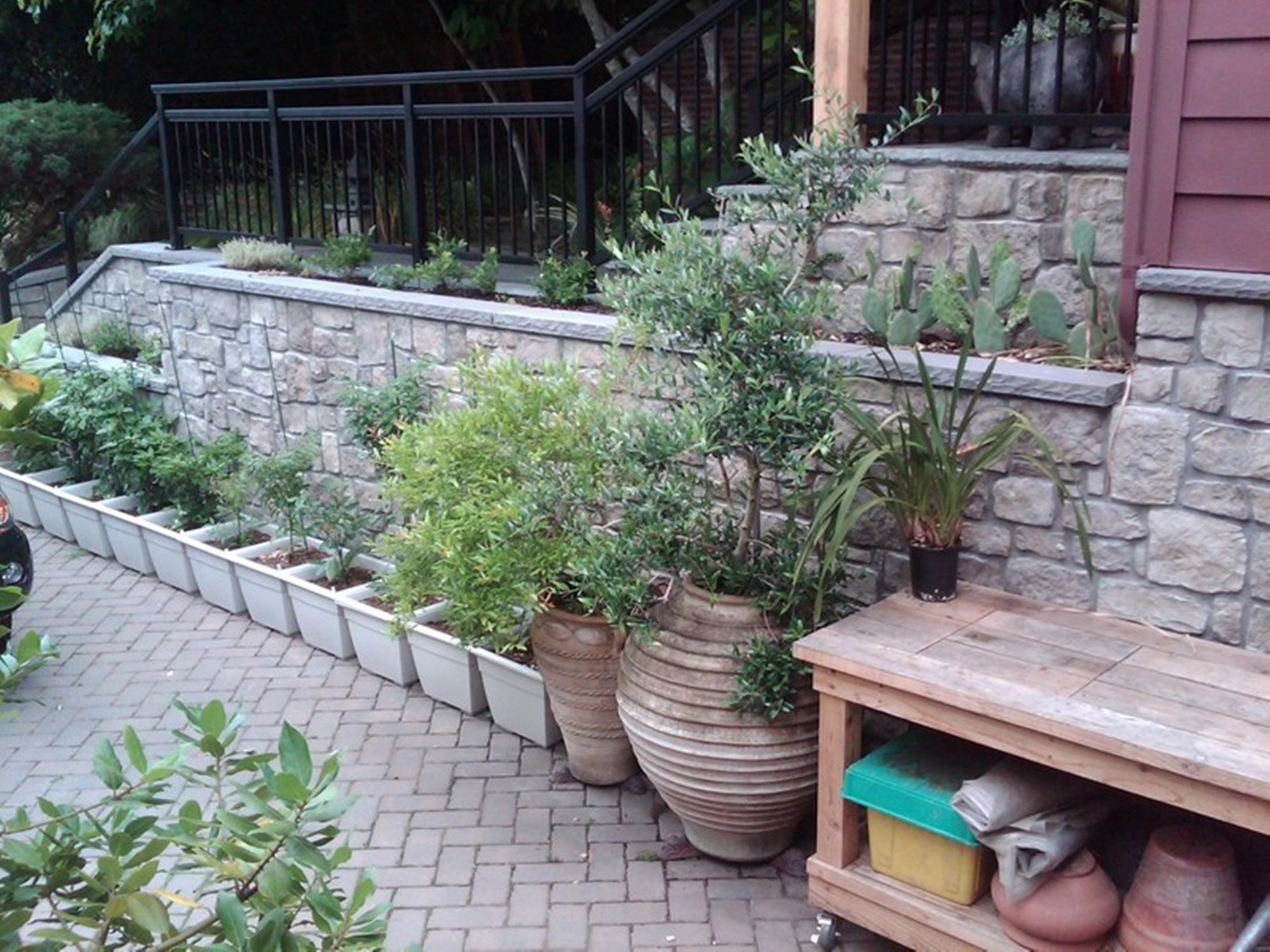 brick_driveway with stone retaining wall.